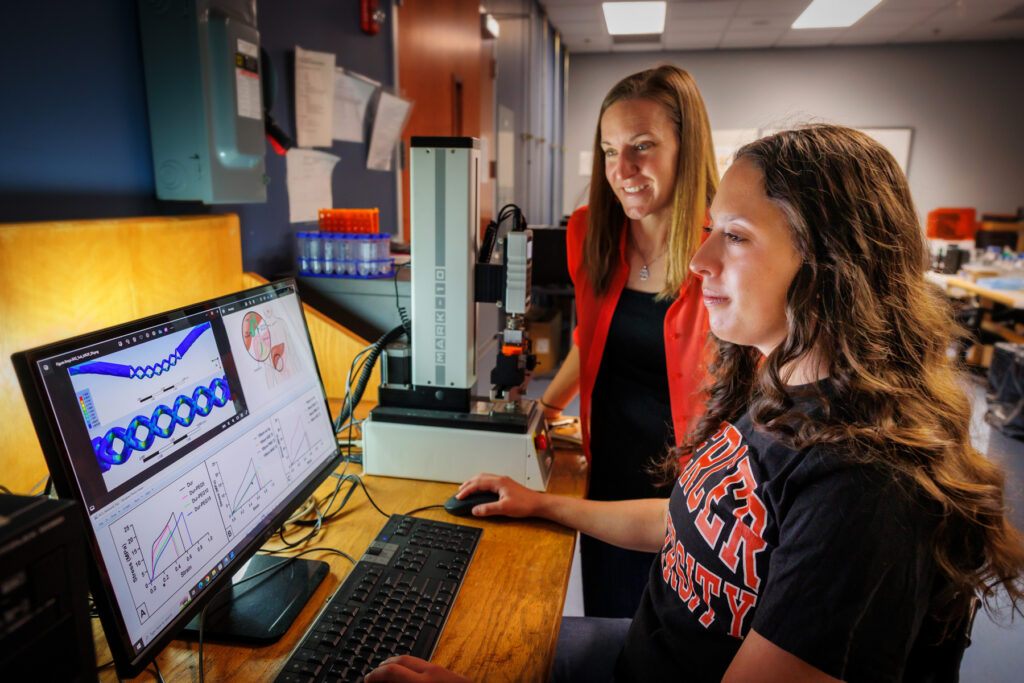 Ainsley Westbrook, right, works in the lab of Dr. Joanna Thomas.